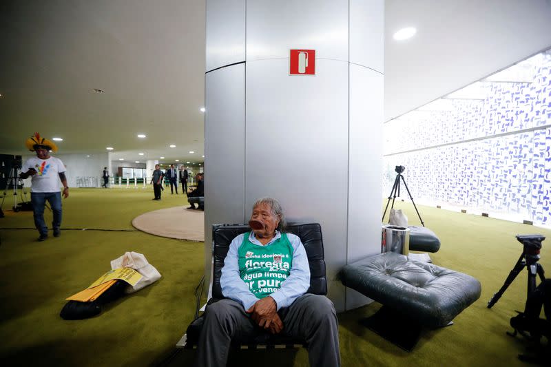 Brazil's indigenous chief Raoni Metuktire looks on after meeting with the parliamentary front in defense of the rights of indigenous peoples at the chamber of deputies in Brasilia