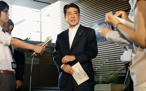 Japanese Prime Minister Shinzo Abe speaks to reporters about North Korea's missile launch in Tokyo - Credit: Reuters