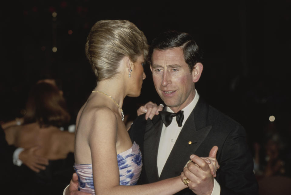 British Royals Diana, Princess of Wales (1961-1997), wearing a blue chintz taffeta Catherine Walker ballgown,  and her husband Charles, Prince of Wales dance together at a dinner dance, held at the Hotel Hyatt in Melbourne, Australia, 27th January 1988. The Royal couple is on a ten-day tour of Australia, marking the 200th anniversary of the continent's first European settlement. (Photo by Tim Graham Photo Library via Getty Images)