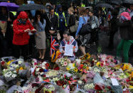 <p>People look at floral tributes after a vigil to remember the victims of the attack on London Bridge and Borough Market, at Potters Field Park, in central London, Britain, June 5, 2017. (Photo: Marko Djurica/Reuters) </p>