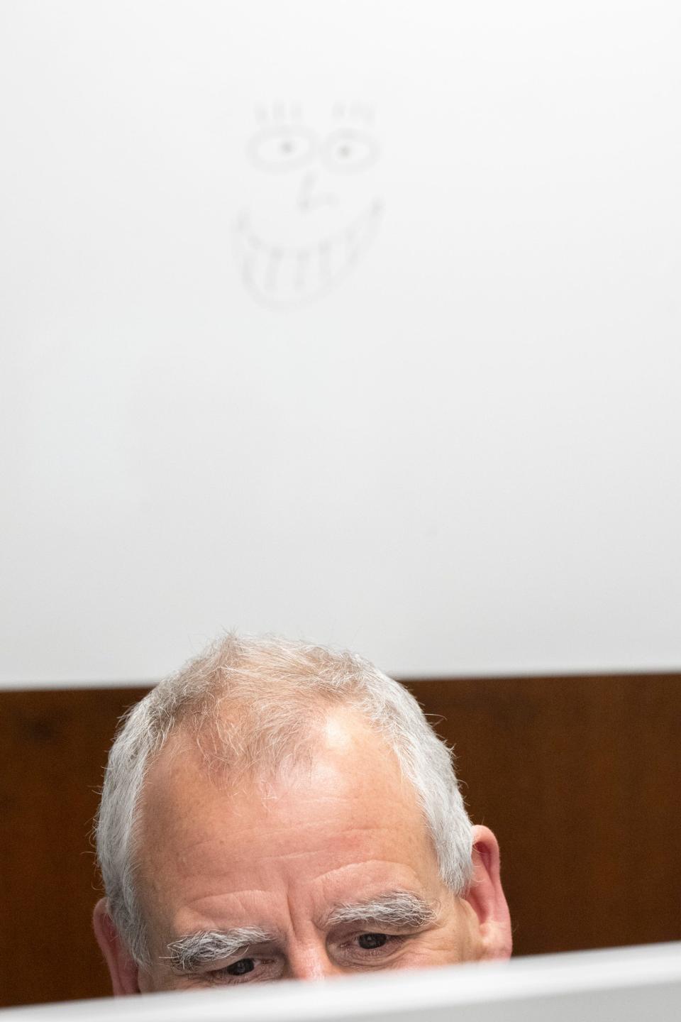 Dr. Geoffrey Eubank, chief of neurology for OhioHealth, smiles while speaking with patient Janet Tharp during an appointment Wednesday at the health system's Riverside Methodist Hospital.