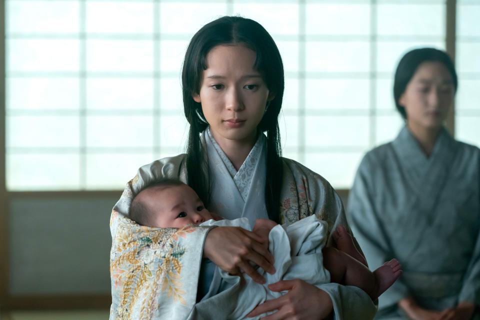 Moeka Hoshi as Usami Fuji and her infant son.