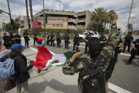 <p>Police force protesters down a street and away from Trump supporters jeering from a parking structure near a campaign rally by GOP presidential candidate Donald Trump at the Anaheim Convention Center on May 25, 2016, in Anaheim, Calif. (David McNew/Getty Images) </p>