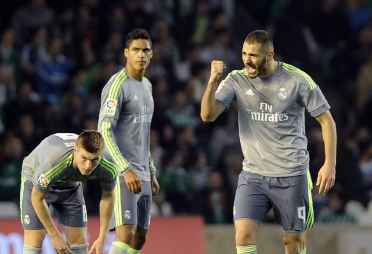 Real Madrid's Karim Benzema (R) celebrates scoring a goal during their Spanish La Liga match against Real Betis, at the Benito Villamarin stadium in Sevilla, on January 24, 2016