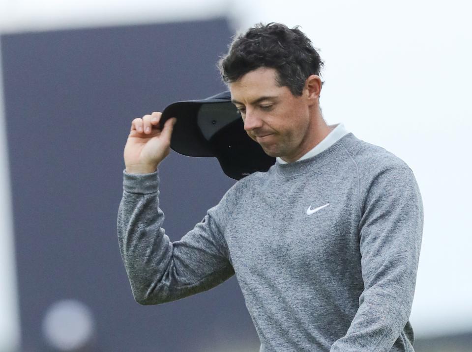 A dejected Rory McIlroy waves to the crowds on the 18th hole after coming one stroke shy of making the cut at the 2019 Open Championship.