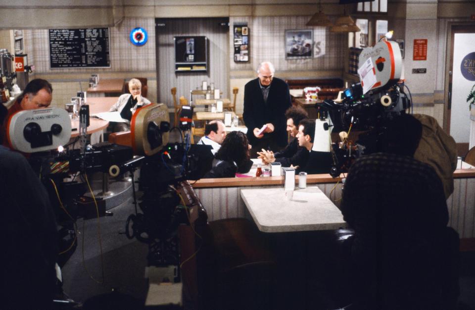 A scene being filmed inside the Monk’s Café set