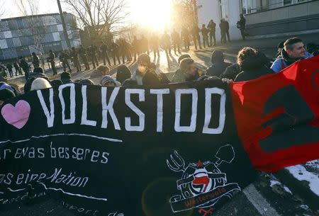 Activists block a street in front of the building where European far-right leaders meet, in Koblenz, Germany, January 21, 2017. REUTERS/Kai Pfaffenbach