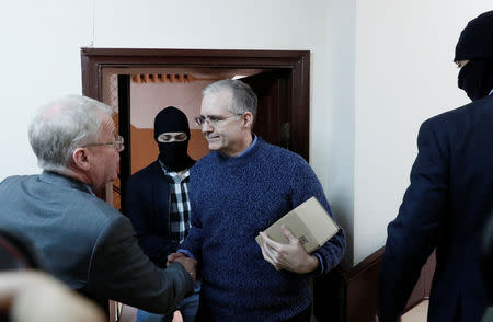 Former U.S. Marine Paul Whelan, who was detained on suspicion of spying, is escorted inside a court building before a hearing regarding the extension of his detention, in Moscow, Russia, May 24, 2019. REUTERS/Shamil Zhumatov