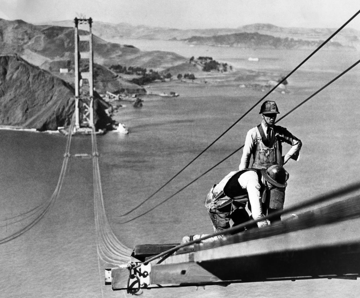 Picture dated October 1935 of the Golden Gate bridge, in the San Francisco Bay, during its construction. Construction began on 05 January 1933 and the bridge was inaugurated 27 May 1937 by Franklin Delano Roosevelt, who pushed a button in Washington, DC, signaling the official start of vehicle traffic over the Bridge. Idea of the engineer Joseph Strauss, it was the largest suspension bridge in the world. (Photo credit should read OFF/AFP via Getty Images)