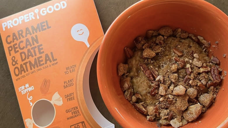 Proper good instant oatmeal box with orange bowl