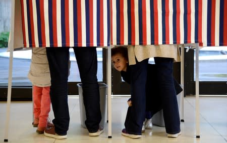 FILE PHOTO: French citizens living in US cast their presidential votes at French Embassy in Washington