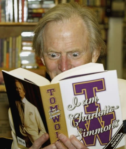 Wolfe reads a copy of his 2004 novel "I Am Charlotte Simmons"