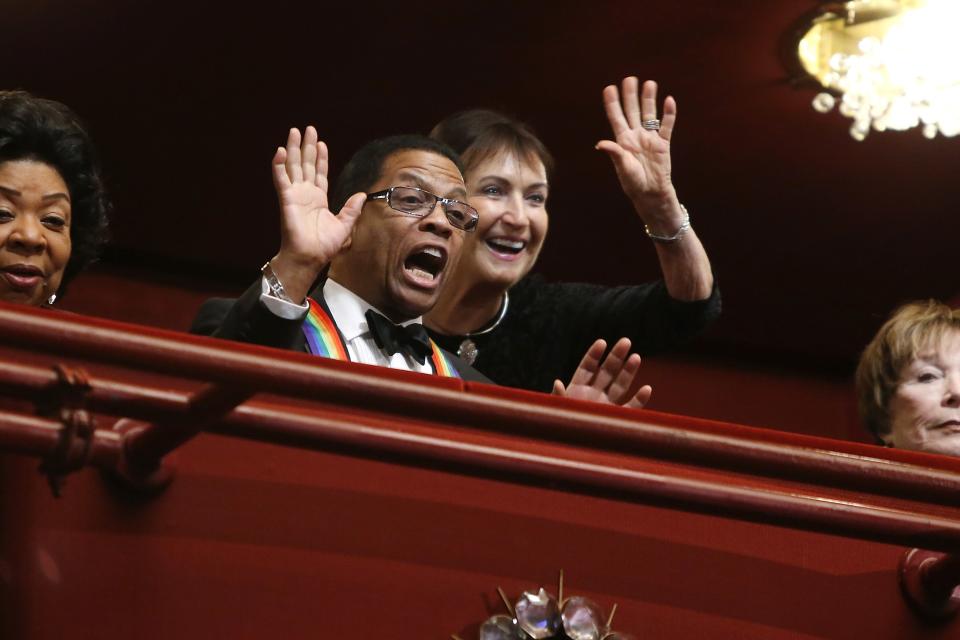 Herbie Hancock spots someone in the audience below at the start of the Kennedy Center Honors in Washington