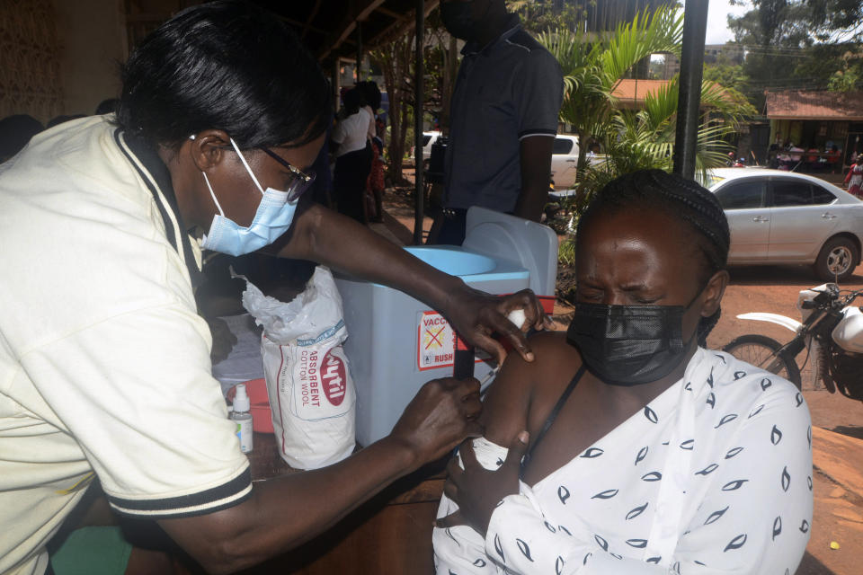 A Ugandan woman receives a dose of yellow fever vaccine at Kiswa Health Center III in Kampala, Uganda Tuesday, April 2, 2024. Uganda has rolled out a nationwide yellow fever vaccination campaign to help safeguard its population against the mosquito-borne disease that has long posed a threat. (AP Photo)