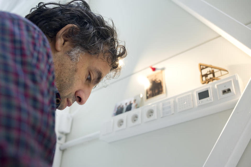 World's thinnest house Keret working at desk