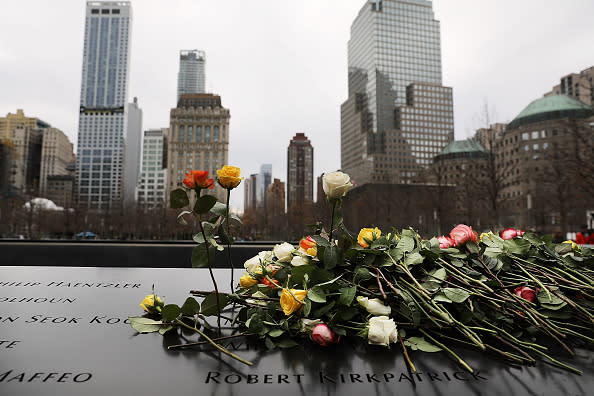 Flowers are placed on the names inscribed on the north reflecting pool of the National September 11 Memorial for those killed in the Feb. 26, 1993 truck bomb attack at the World Trade Center in New York City on the 25th anniversary of the bombing. (Photo by Spencer Platt/Getty Images)