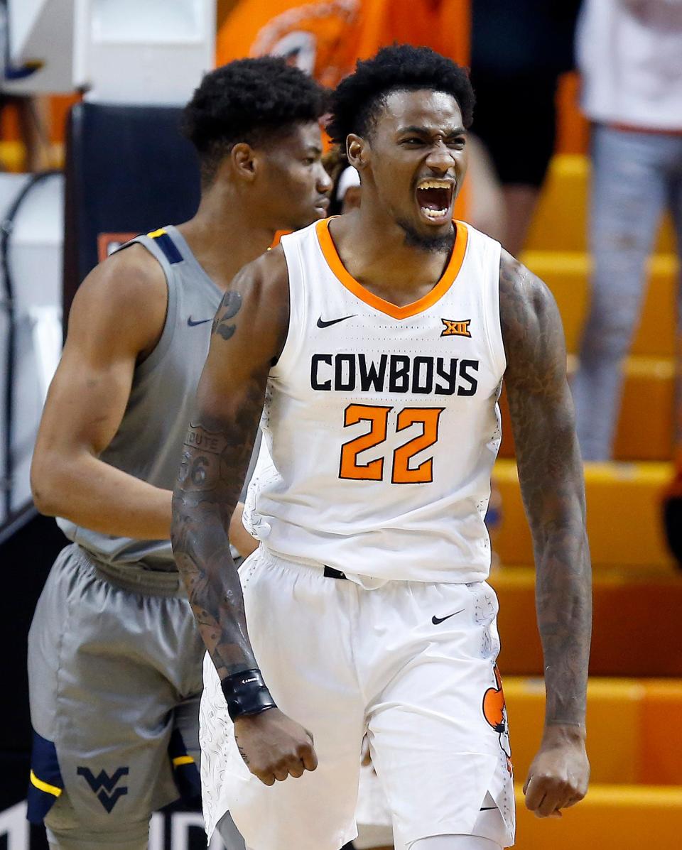 Oklahoma State's Kalib Boone (22) celebrates in the second half of a 67-60 win against West Virginia on Monday night at Gallagher-Iba Arena in Stillwater.