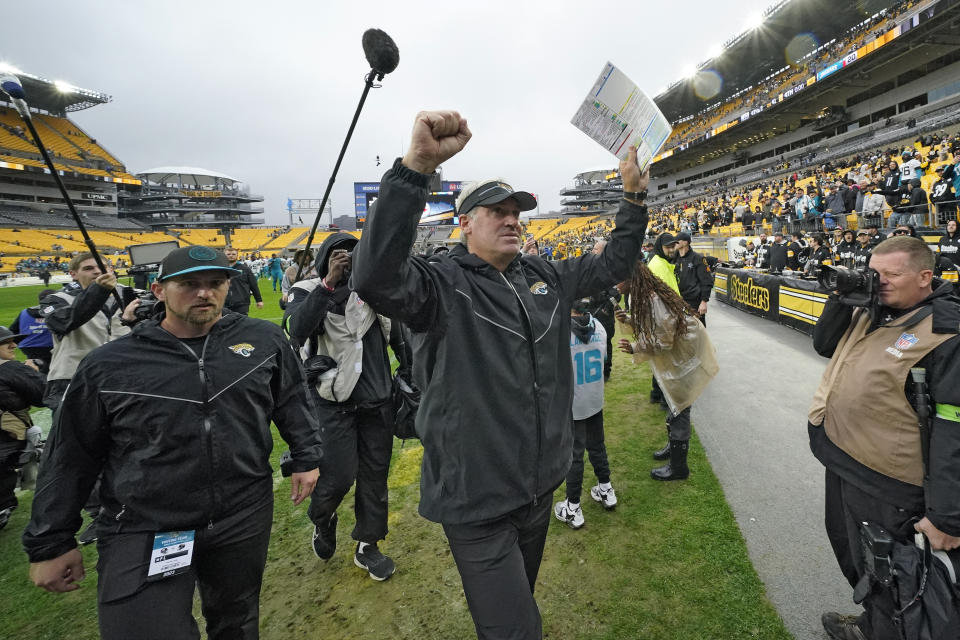 Jacksonville Jaguars head coach Doug Pederson, center, celebrates after the team defeated the Pittsburgh Steelers during an NFL football game Sunday, Oct. 29, 2023, in Pittsburgh. (AP Photo/Gene J. Puskar)