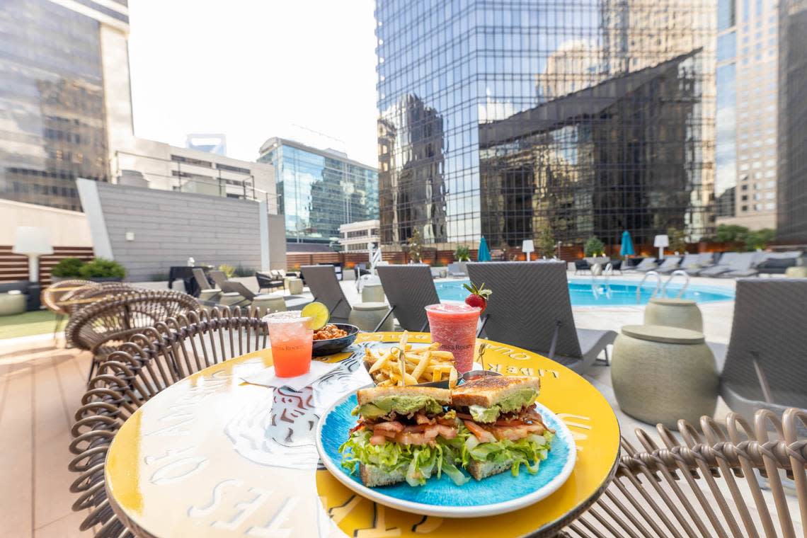 Coin Bar is Omni Charlotte’s rooftop bar. Table art is by Tim Sheaffer.