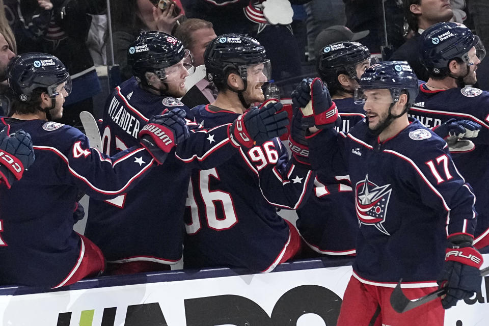 Columbus Blue Jackets right wing Justin Danforth (17) celebrates after his goal with teammates in the first period of an NHL hockey game against the Vegas Golden Knights, Monday, March 4, 2024, in Columbus, Ohio. (AP Photo/Sue Ogrocki)