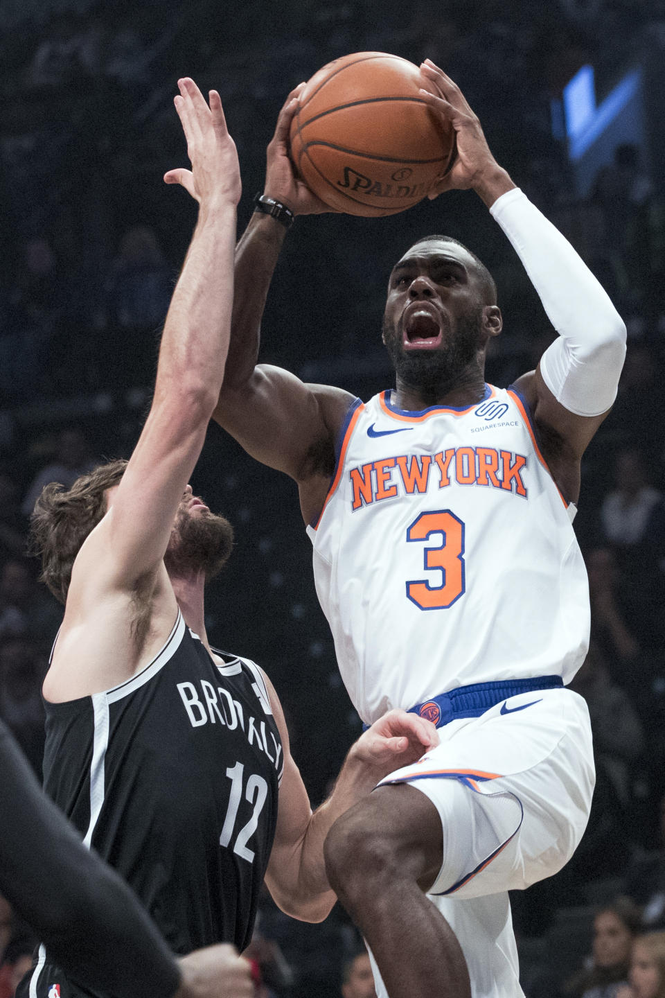 New York Knicks guard Tim Hardaway Jr. (3) goes to the basket against Brooklyn Nets forward Joe Harris (12) during the first half of an NBA basketball game, Friday, Oct. 19, 2018, in New York. (AP Photo/Mary Altaffer)