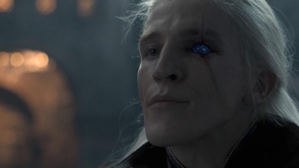 Prince Aemond Targaryen showing off his sapphire eye from House of the Dragon's season one finale