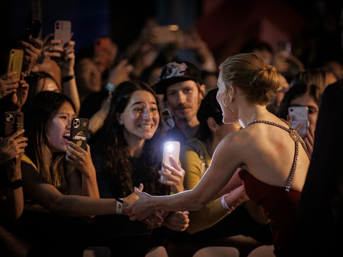 Scenes from the red carpet of a TIFF premiere. Buzz from the festival could influence when and if Canadians will be able to see films that played at the festival. (Evan Mitsui/CBC - image credit)