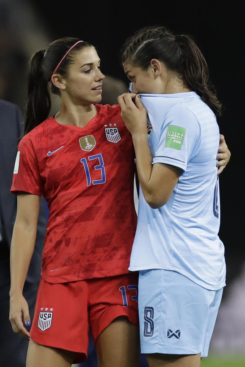 United States'Alex Morgan hugs Thailand's Miranda Nild at the end of the Women's World Cup Group F soccer match between United States and Thailand at the Stade Auguste-Delaune in Reims, France, Tuesday, June 11, 2019. United States beat Thailand 13-0. (AP Photo/Alessandra Tarantino)