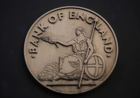 The logo is seen at the Bank of England in the City of London January 16, 2014. REUTERS/Luke MacGregor