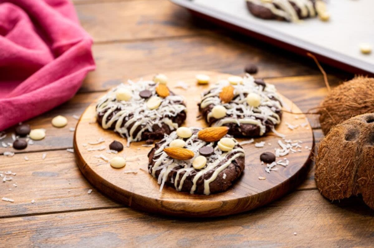 <p>Julie's Eats and Treats</p><p>If you love the Almond Joy Candy bar you are going to want to make a batch or two of these easy Almond Joy Cookies! They start with a brownie mix and are topped with coconut, almonds and drizzled with chocolate to create flavors reminiscent of your favorite candy bar.</p><p><strong>Get the recipe: <a href="https://www.julieseatsandtreats.com/almond-joy-cookies/" rel="nofollow noopener" target="_blank" data-ylk="slk:Almond Joy Cookies;elm:context_link;itc:0;sec:content-canvas" class="link rapid-noclick-resp">Almond Joy Cookies</a></strong></p>