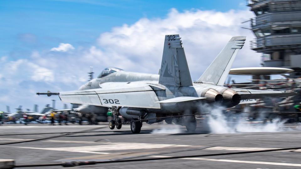 An F/A-18E Super Hornet, attached to Strike Fighter Squadron 115, lands on the flight deck of the aircraft carrier Ronald Reagan in the Philippine Sea Aug. 17 during flight operations in support of Large Scale Exercise 2023. (MC2 Daniel Providakes/Navy)