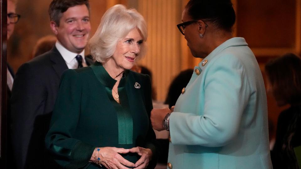 Queen Camilla speaks to Patricia Scotland, Baroness Scotland as they attend the Commonwealth Women Leader's event at Marlborough House