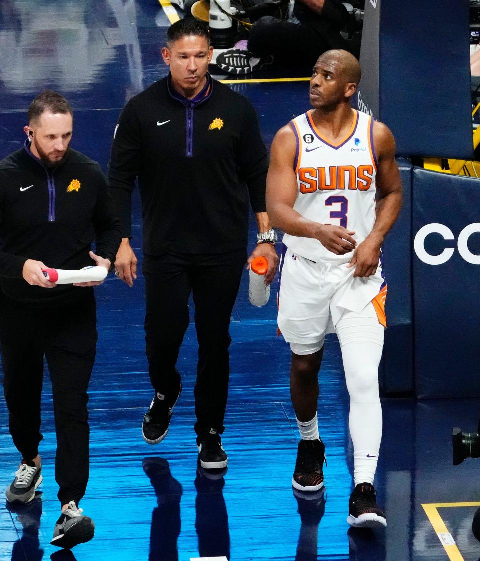 Phoenix Suns guard Chris Paul (3) leaves the game with a groin injury against the Denver Nuggets in the third quarter during Game 2 of the Western Conference Semifinals at Ball Arena in Denver on May 1, 2023.