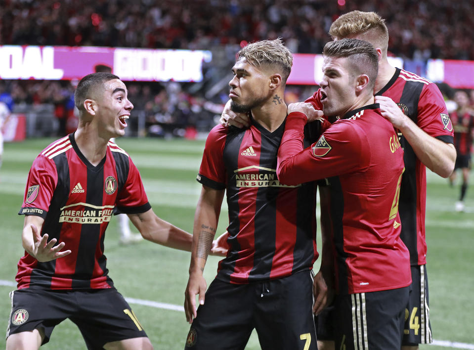 Miguel Almiron (from left), Josef Martinez, Greg Garza and Atlanta United are all but in MLS Cup after beating the New York Red Bulls 3-0 on Sunday. (Curtis Compton/AP)<span> </span>