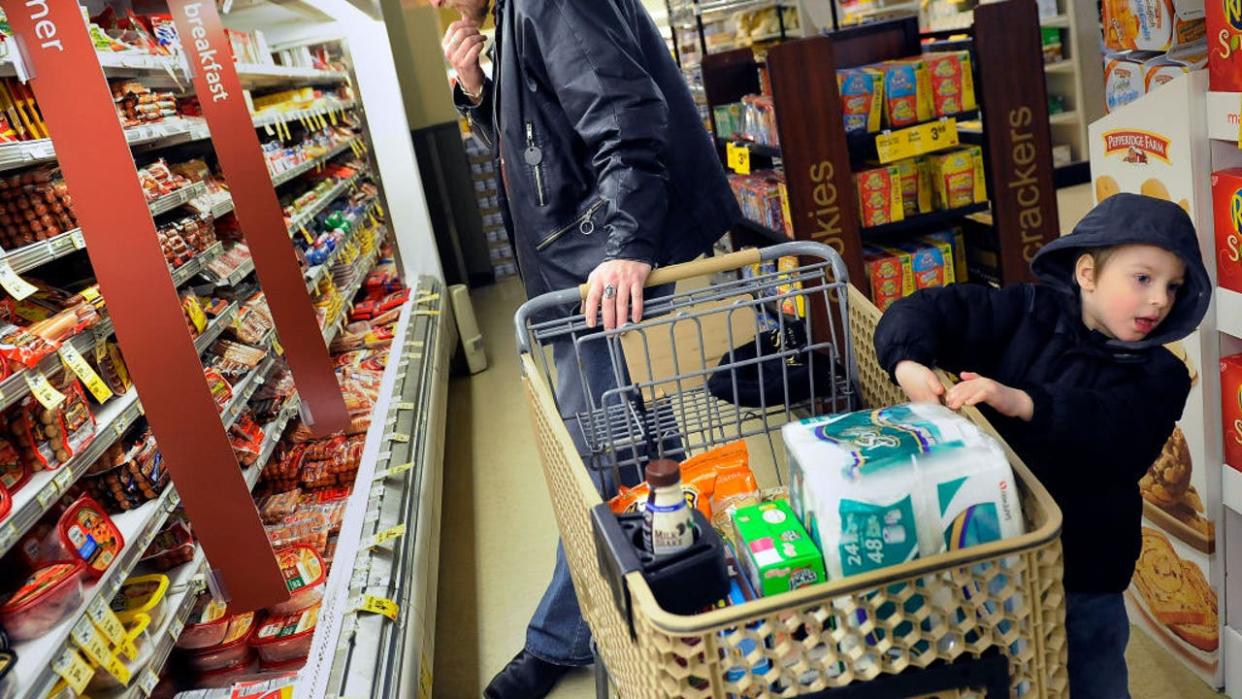 <div>Bos and his four-year-old son Niels shop for groceries at a Safeway near the family's home.</div>