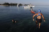 U.S. long-distance swimmer Diana Nyad jumps into the waters of Havana's Hemingway Marina August 31, 2013. REUTERS/Enrique De La Osa