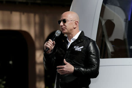 Amazon and Blue Origin founder Jeff Bezos addresses the media about the New Shepard rocket booster and Crew Capsule mockup at the 33rd Space Symposium in Colorado Springs, Colorado, United States April 5, 2017. REUTERS/Isaiah J. Downing