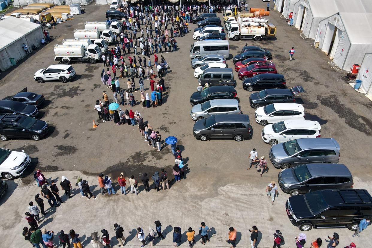 This aerial picture shows people queueing to receive the Sinovac COVID-19 vaccine in Jakarta, Indonesia on Aug. 12, 2021.