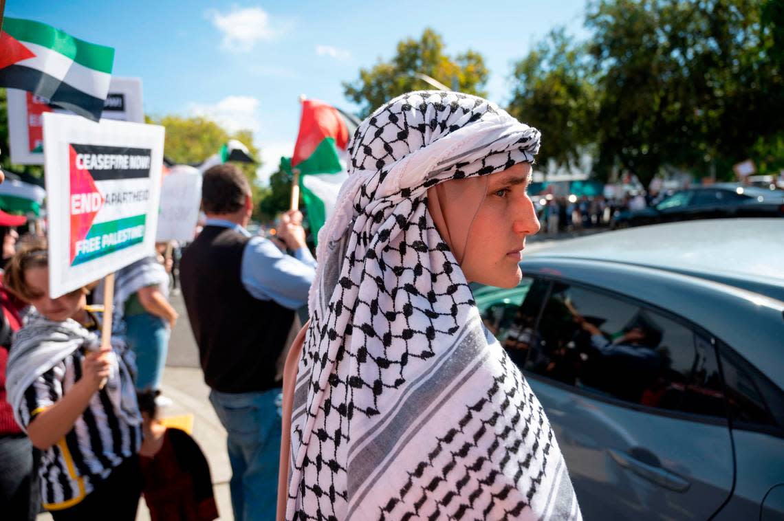 Rebekah Qinnab of Lodi wears a keffiyeh while at a rally hosted by the Sacramento Regional Coalition for Palestinian Rights on Saturday, Oct. 14, 2023.