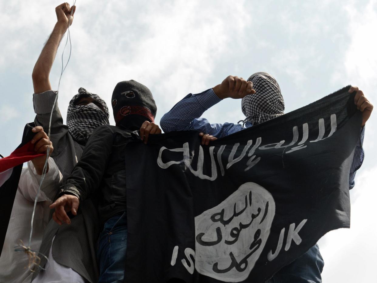 File Photo: Kashmiri demonstrators hold up the ISIS flag during protests in 2014: AFP/Getty Images