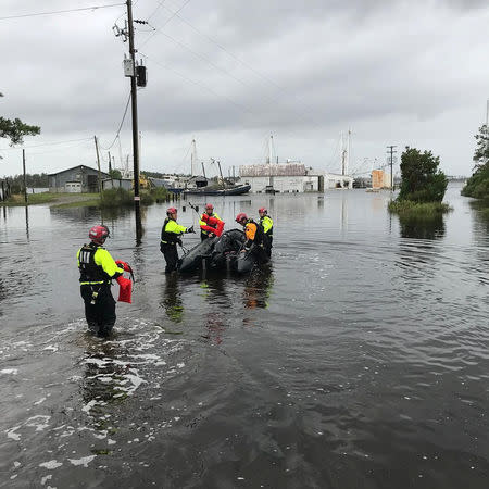 Urban Search and Rescue NY-TF1 Alpha team work with local officials to conduct wellness checks & an evacuation on Goose Creek Island in Pamlico County, North Carolina, U.S. September 15, 2018. NYC Emergency Management/Handout via REUTERS