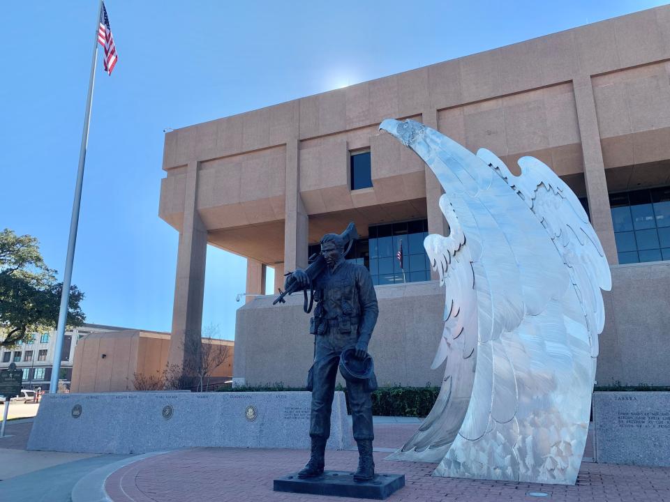 The veterans' memorial stands a silent watch over the Taylor County Courthouse.