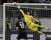 Frankfurt's goal keeper Kevin Trapp makes a save during the second leg, round of 32, Europa League soccer match between Eintracht Frankfurt and FC Shakhtar Donetsk, in Frankfurt, Germany, Thursday, Feb. 21, 2019. (AP Photo/Michael Probst)