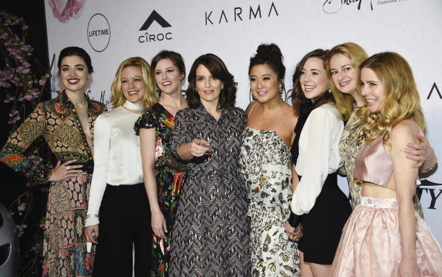 Honoree Tina Fey, center, surrounded by the cast of Broadway's &quot;Mean Girls&quot;, from left, Barrett Wilbert Weed, Kate Rockwell, Taylor Louderman, Ashley Park, Erika Henningsen, screenwriter Nell Benjamin and actress Kerry Butler at Variety's Power of Women: New York event at Cipriani Wall Street on Friday, April 13, 2018, in New York. (Photo by Evan Agostini/Invision/AP)