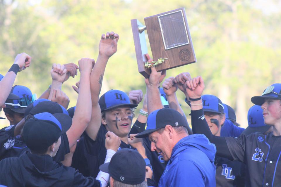 The Inland Lakes baseball team celebrates a third consecutive outright Ski Valley title after sweeping Gaylord St. Mary at Cooperation Park in Indian River on Wednesday.