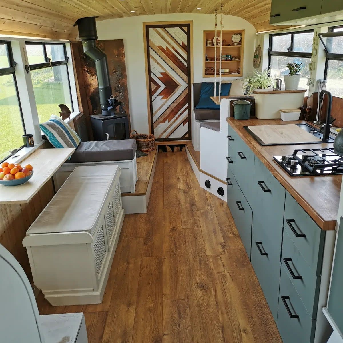 The kitchen and living space downstairs (Lamorna Hollingsworth/@we_bought_a_double_decker)