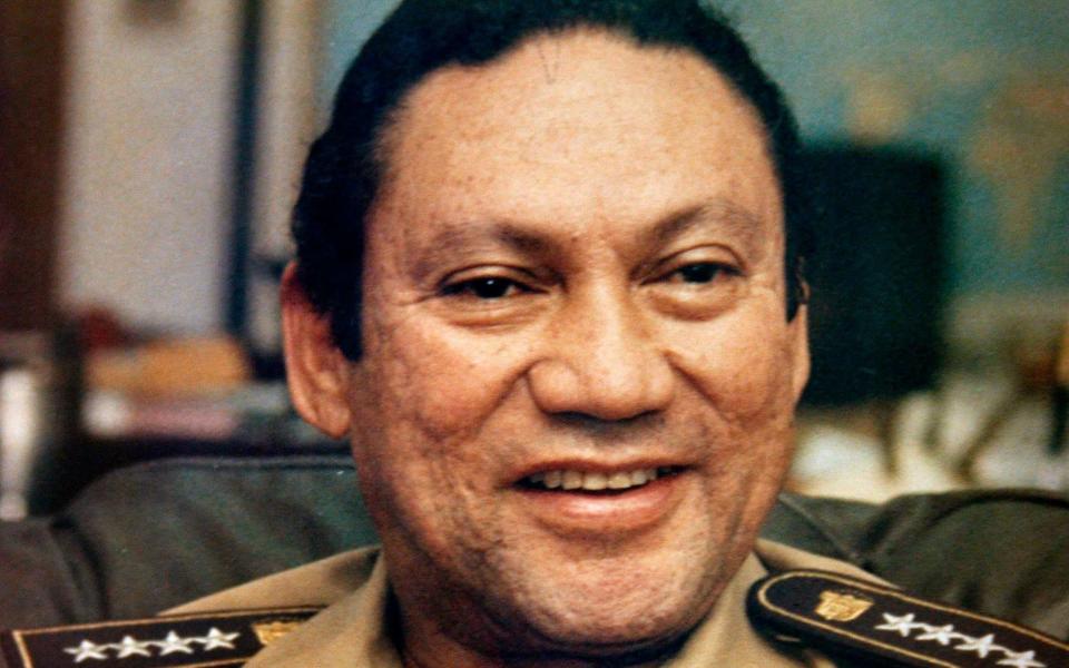 Panamanian military strongman Gen. Manuel Antonio Noriega talks to reporters in Panama City, in this Nov. 8, 1989 - AP