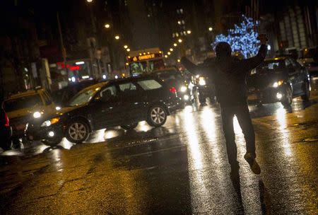 Demonstrators disrupt traffic during a march for chokehold death victim Eric Garner in New York December 6, 2014. REUTERS/Brendan McDermid