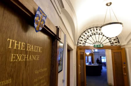 A wooden plaque is seen on a wall at The Baltic Exchange in the City of London, Britain March 2, 2016. REUTERS/Toby Melville/File Photo