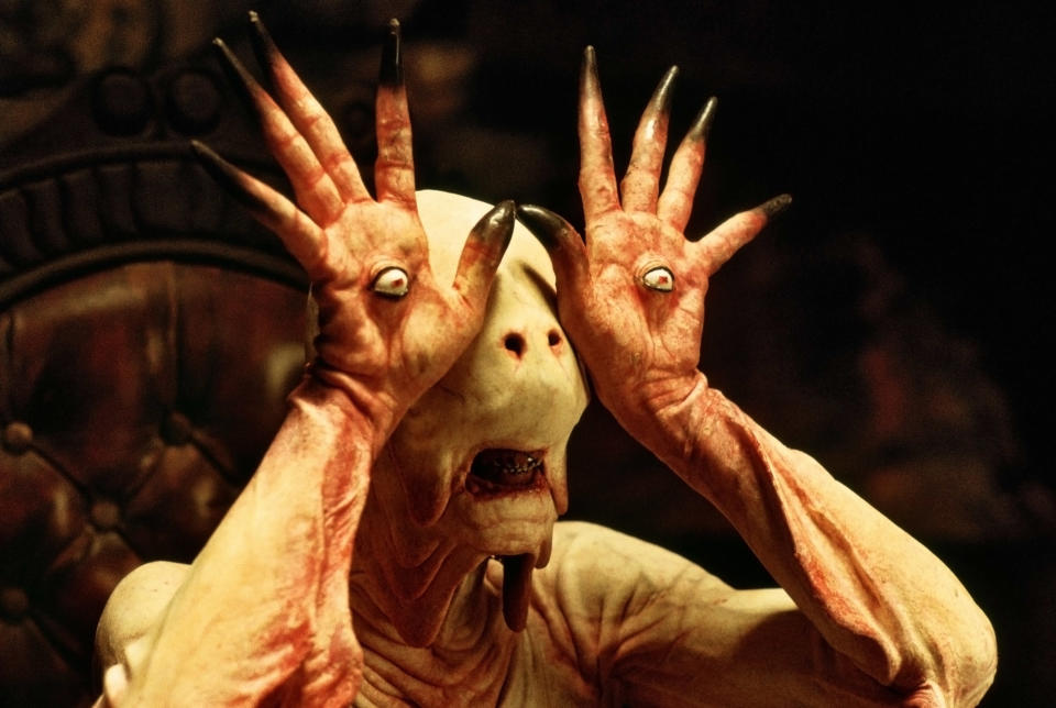 alien creature with eyeballs on its palms